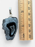 Making Waves Jewelry and Accessories agate slice pendant in charcoal and white with a 925 sterling silver setting.