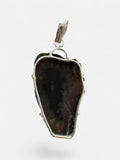 Making Waves Jewelry and Accessories agate slice pendant in charcoal and white with a 925 sterling silver setting.