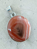 Making Waves Jewelry and Accessories handcrafted agate pendant with terracotta and amber bands in sterling silver bezel