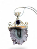 Making Waves Jewelry and Accessories amethyst stalactite slice pendant with faceted accent in sterling silver setting