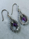 Making Waves Jewelry and Accessories sterling silver dangle earrings with purple amethyst stones in filigree frames.