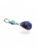Making Waves Jewelry and Accessories sterling silver pendant with a purple amethyst teardrop and round turquoise stone.