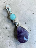 Making Waves Jewelry and Accessories sterling silver pendant featuring a purple amethyst teardrop and turquoise stone