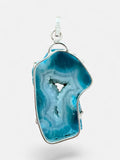 Making Waves Jewelry and Accessories blue agate geode slice pendant with crystalline center in sterling silver setting