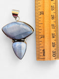 Making Waves Jewelry and Accessories blue chalcedony pendant with two stones in a sterling silver bezel setting.