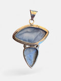 Making Waves Jewelry and Accessories blue chalcedony pendant in 925 sterling silver with an asymmetrical design.
