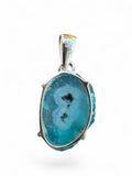 Making Waves Jewelry and Accessories blue druzy agate pendant in a 925 sterling silver prong setting.