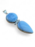 Making Waves Jewelry and Accessories double stone pendant featuring blue opal cabochons in a sterling silver setting.