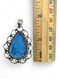 Making Waves Jewelry and Accessories teardrop blue opal pendant in a vintage sterling silver filigree frame with ruler.