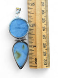 Making Waves Jewelry and Accessories double stone pendant with blue opal cabochons in a sterling silver setting.