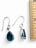 Making Waves Jewelry and Accessories blue teardrop dangle earrings with silver-tone hook settings on white background