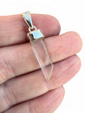 Making Waves Jewelry and Accessories clear quartz crystal point pendant in a polished sterling silver setting.