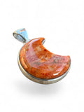 Making Waves Jewelry and Accessories crescent moon pendant featuring a polished orange marbled gemstone in sterling silver