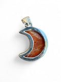 Making Waves Jewelry and Accessories crescent moon pendant with orange marbled gemstone in polished sterling silver.