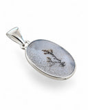 Making Waves Jewelry and Accessories oval dendritic agate pendant in a polished sterling silver bezel setting.