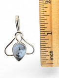 Making Waves Jewelry and Accessories teardrop pendant with dendritic agate and sterling silver next to a ruler