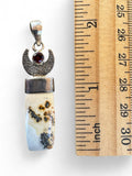 Making Waves Jewelry and Accessories sterling silver pendant with dendritic agate, crescent moon, and red garnet stone.