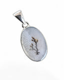 Making Waves Jewelry and Accessories oval dendritic agate pendant with dark fern-like inclusions in sterling silver.