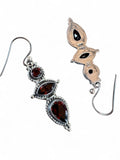 Making Waves Jewelry and Accessories sterling silver drop earrings with red garnet gemstones in a tiered design.