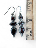 Making Waves Jewelry and Accessories sterling silver drop earrings with red garnet gemstones and vintage rope detailing.