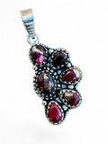 Making Waves Jewelry and Accessories artisan garnet pendant with oxidized sterling silver and beaded detailing.