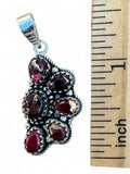 Making Waves Jewelry and Accessories garnet cluster pendant in oxidized 925 sterling silver with beaded detailing.