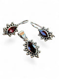 Making Waves Jewelry and Accessories garnet and sterling silver pendant and drop earring set with beaded borders.