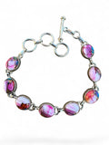 Making Waves Jewelry and Accessories artisan sterling silver link bracelet with multi-colored pink gemstone cabochons