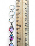 Making Waves Jewelry and Accessories handcrafted sterling silver bracelet with multi-colored gemstone oval links