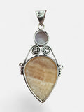 Making Waves Jewelry and Accessories sterling silver pendant with yellow calcite and moonstone in scrollwork setting