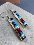 Making Waves Jewelry and Accessories sterling silver dangle earrings with geometric inlay in blue, turquoise, and red.