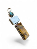 Making Waves Jewelry and Accessories geometric pendant featuring tiger's eye, white stone, and labradorite in silver.