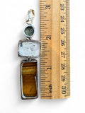 Making Waves Jewelry and Accessories geometric pendant with tiger's eye, white stone, and labradorite in sterling silver