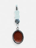 Making Waves Jewelry and Accessories sterling silver pendant featuring a shimmering oval goldstone with rope detailing.