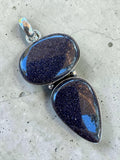 Making Waves Jewelry and Accessories double stone pendant featuring oval and teardrop blue goldstone in sterling silver