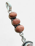 Making Waves Jewelry and Accessories sterling silver pendant featuring stacked oval goldstone cabochons with rope detail