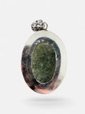 Making Waves Jewelry and Accessories oval green rutilated quartz pendant in a vintage sterling silver setting