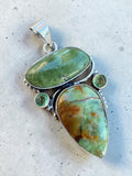 Making Waves Jewelry and Accessories artisan pendant with green natural stones and sterling silver beadwork detailing.