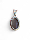 Making Waves Jewelry and Accessories oval grey moonstone pendant in a polished 925 sterling silver bezel setting.