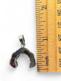 Making Waves Jewelry and Accessories sterling silver horseshoe pendant with turquoise stones measured by a ruler