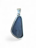Making Waves Jewelry and Accessories iridescent druzy pendant in a polished 925 sterling silver setting.
