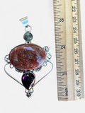 Making Waves Jewelry and Accessories artisan pendant with oval jasper, amethyst teardrop, and sterling silver filigree.
