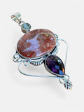 Making Waves Jewelry and Accessories artisan pendant with oval jasper, faceted amethyst, and sterling silver filigree.