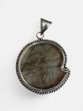 Making Waves Jewelry and Accessories labradorite ammonite fossil pendant in a vintage sterling silver rope frame.
