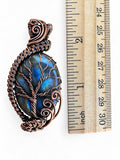 Making Waves Jewelry and Accessories handcrafted labradorite Tree of Life pendant with oxidized copper wire wrapping.