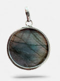 Making Waves Jewelry and Accessories round labradorite pendant in a polished 925 sterling silver bezel setting.