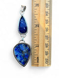 Making Waves Jewelry and Accessories double teardrop Lapis Lazuli pendant in sterling silver next to a ruler