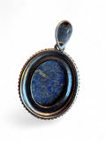 Making Waves Jewelry and Accessories oval lapis lazuli pendant with a beaded sterling silver frame and 925 hallmark.