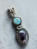 Making Waves Jewelry and Accessories artisan pendant with sky-blue Larimar and purple Amethyst in sterling silver