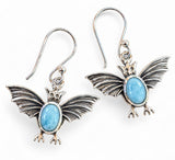 Making Waves Jewelry and Accessories sterling silver bat dangle earrings featuring oval Larimar cabochon gemstones.
